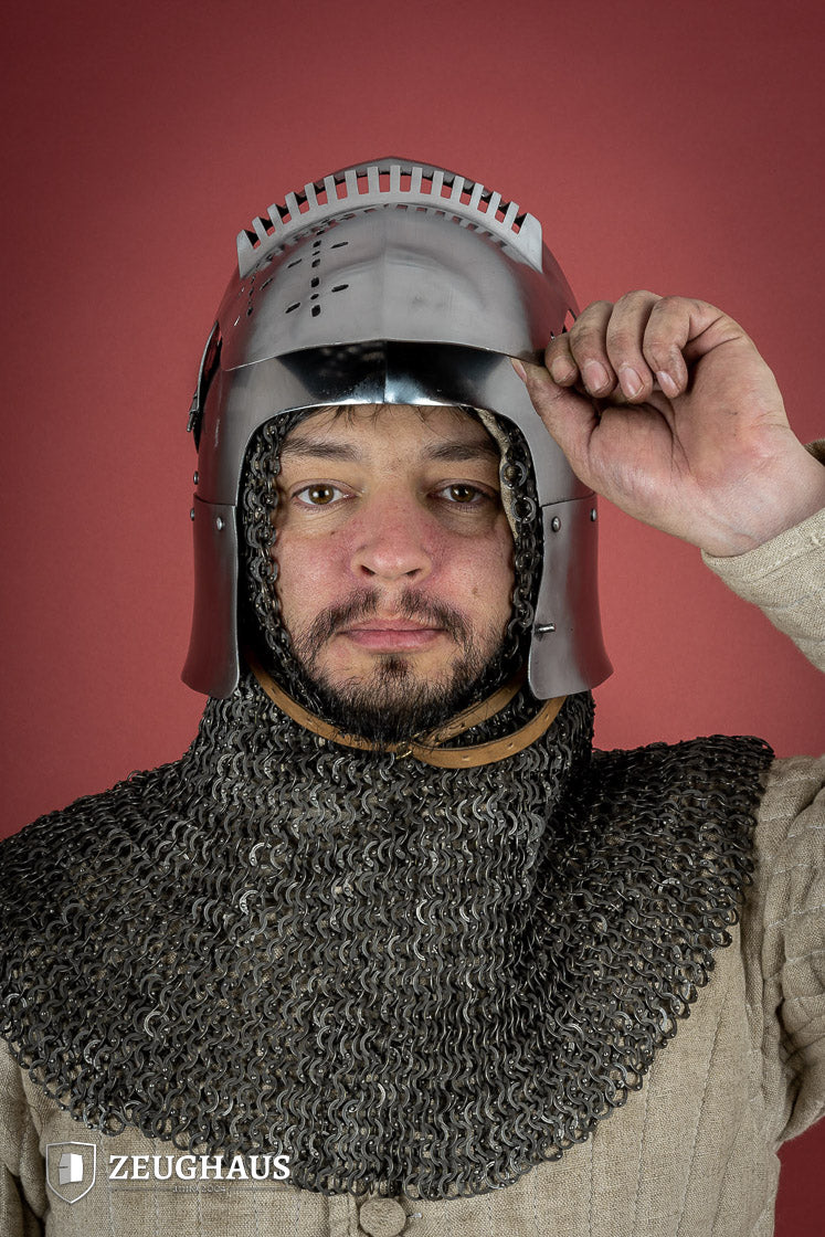 14th-century Bascinet Helmet made of 2mm polished steel with a pyramidal grille visor and leather chin strap.