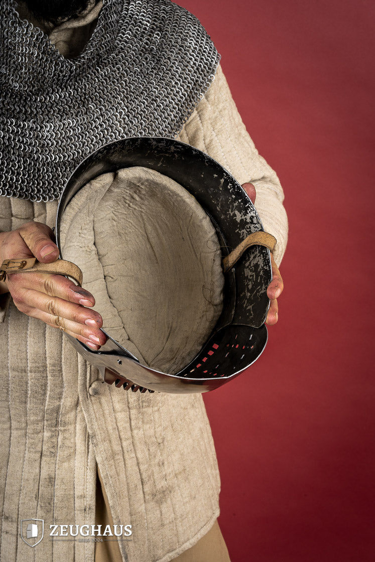 14th-century Bascinet Helmet made of 2mm polished steel with a pyramidal grille visor and leather chin strap.