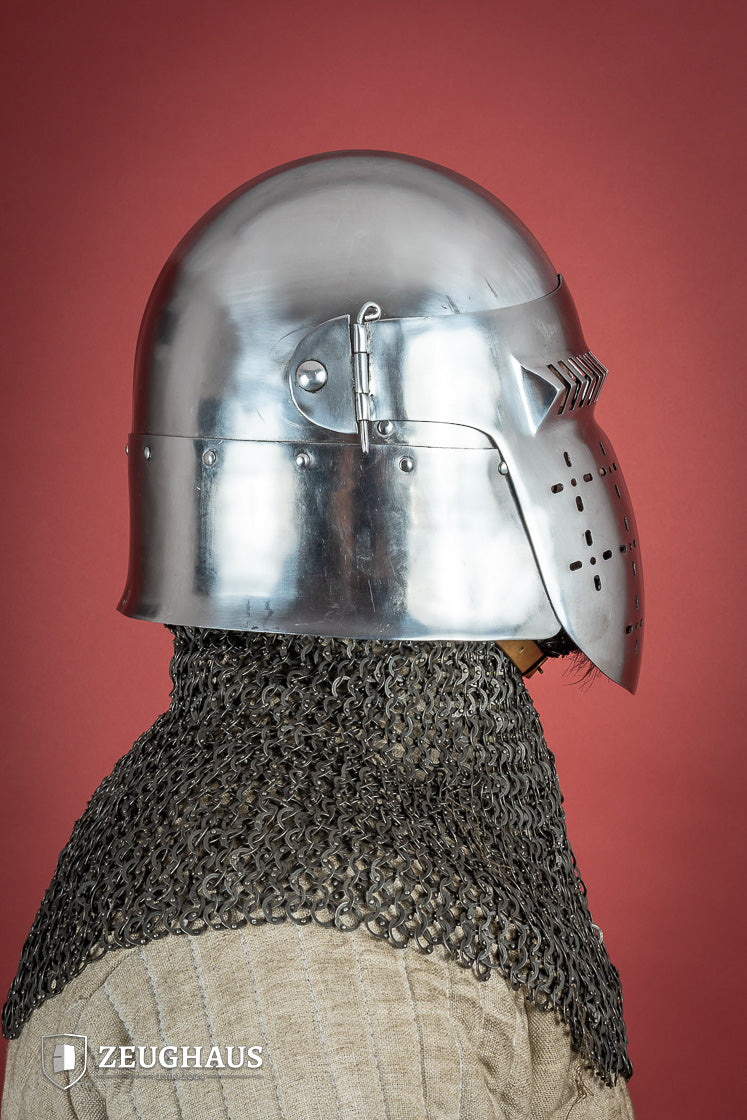 14th-century Bascinet Helmet made of 2mm polished steel with a pyramidal grille visor and leather chin strap.