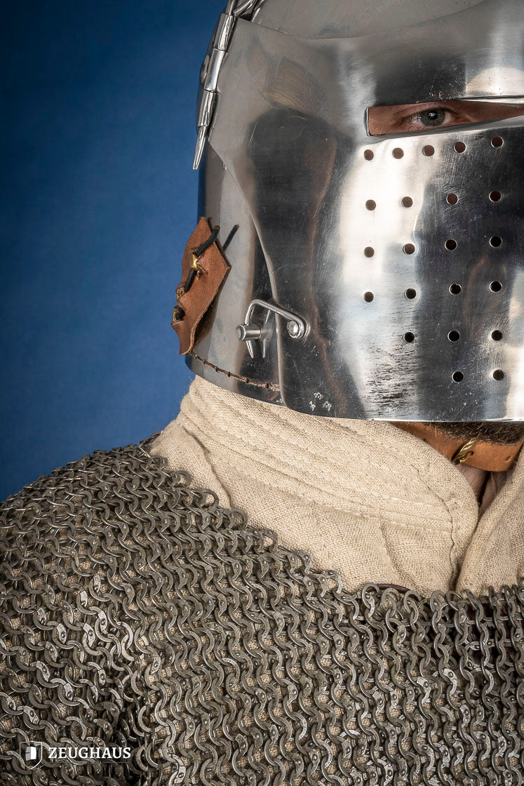 Polished Bascinet Helmet made of 2mm steel with adjustable visor and ventilation holes, featuring a leather chin strap.