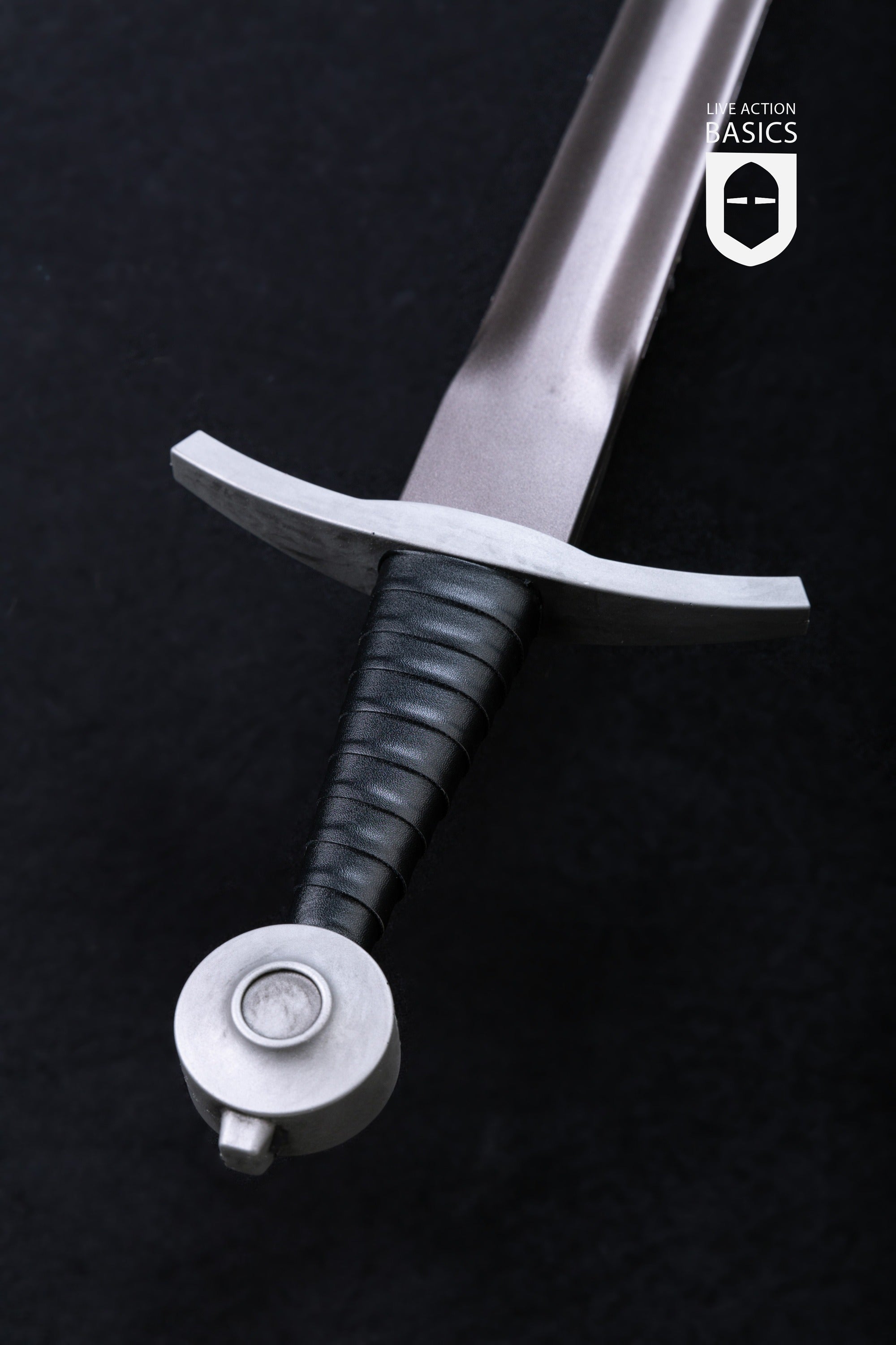Basic Arming Sword Silver with a metallic blade, silver cross guard, and faux leather wrapped hilt, perfect for LARP and cosplay.