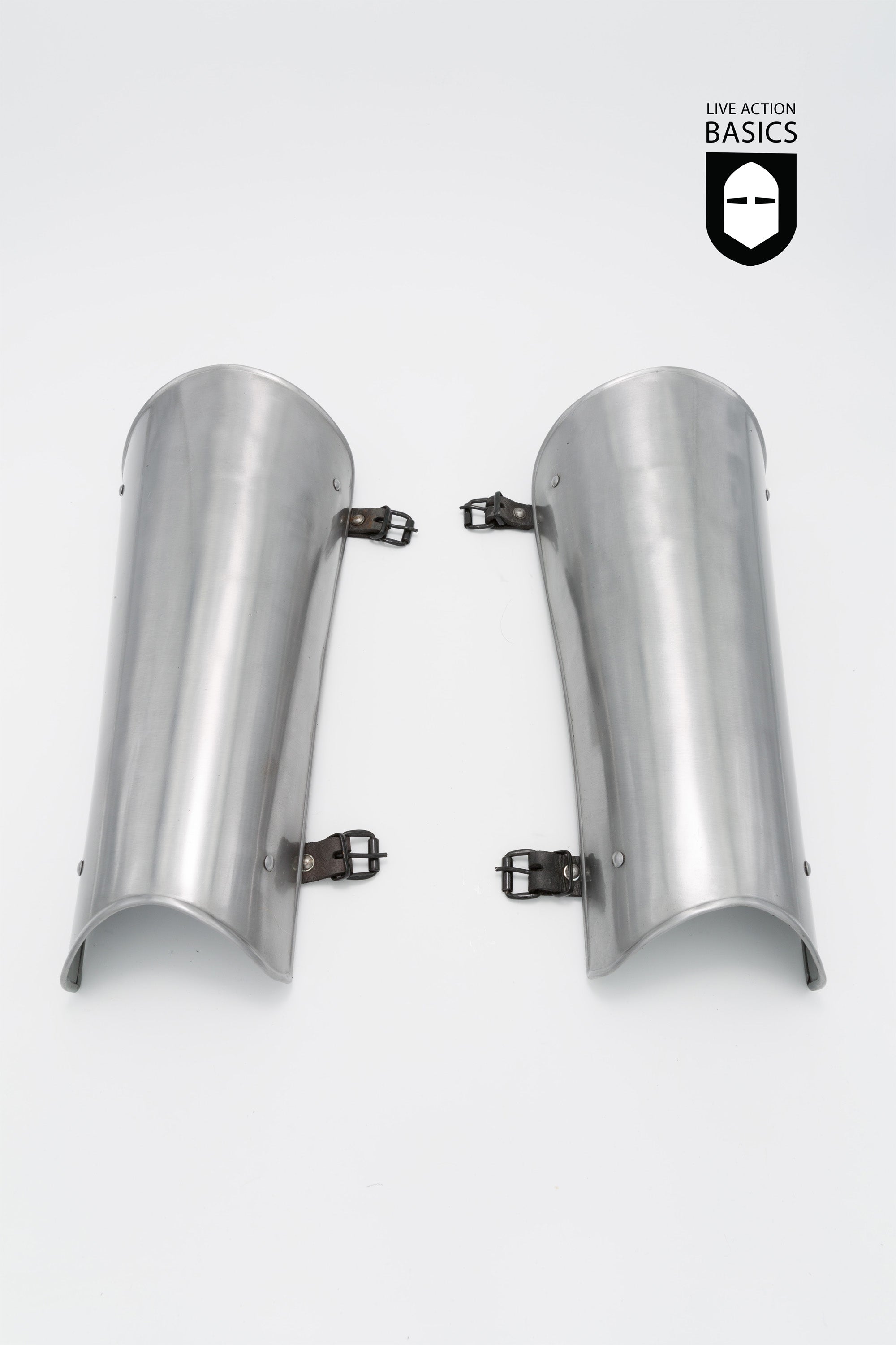 Basic Greaves made of mild steel, featuring adjustable belt-like fastening and metal clasps for secure fit.