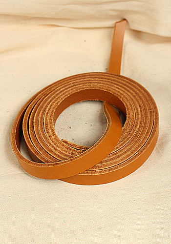 A 15 mm wide cognac full-grain leather belt strap, showcasing its robust texture and rich color, ideal for LARP and medieval costumes.