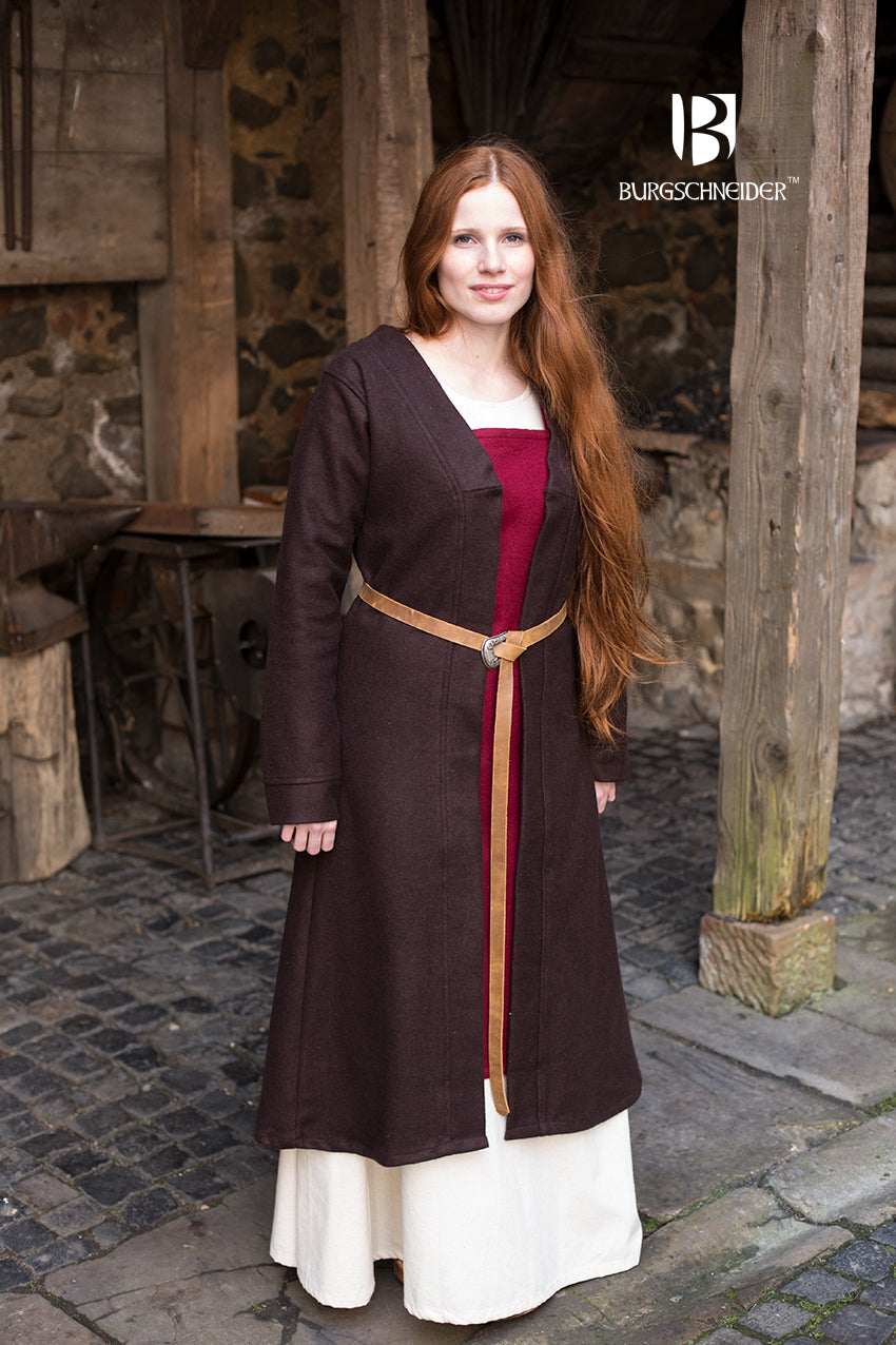 Birka Coat Aslaug in brown, showcasing its long sleeves and calf-length design, inspired by Viking fashion.