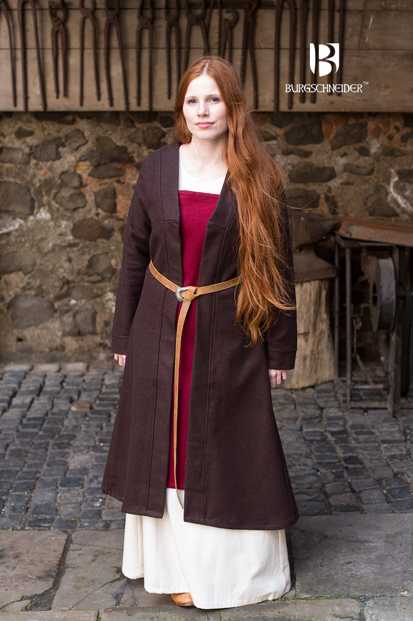 Birka Coat Aslaug in brown, showcasing its long sleeves and calf-length design, inspired by Viking fashion.