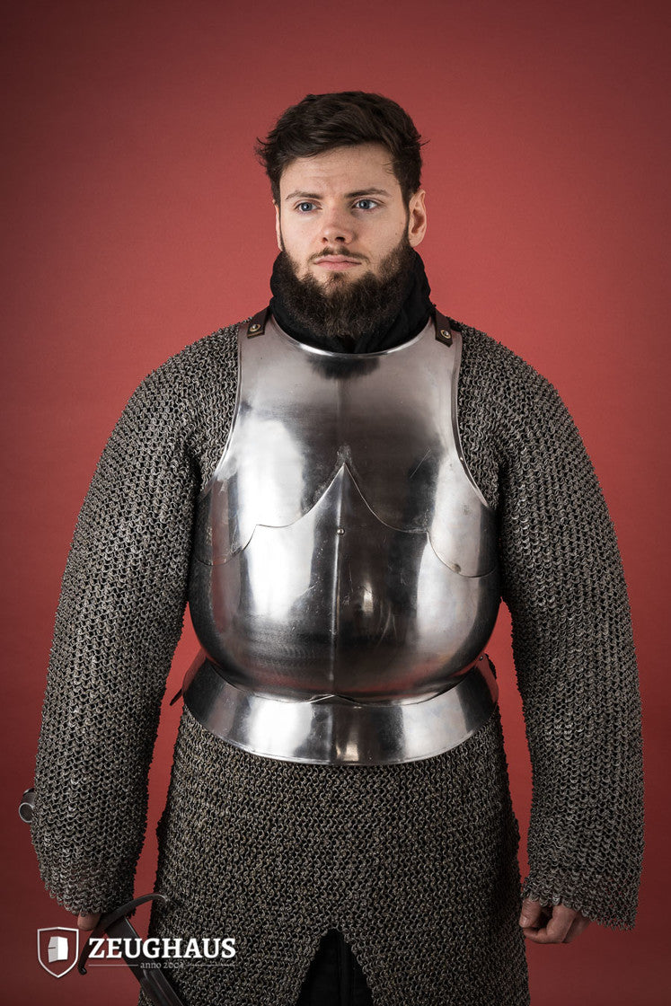 15th Century polished steel breastplate with riveted joints, showcasing historical armor design.