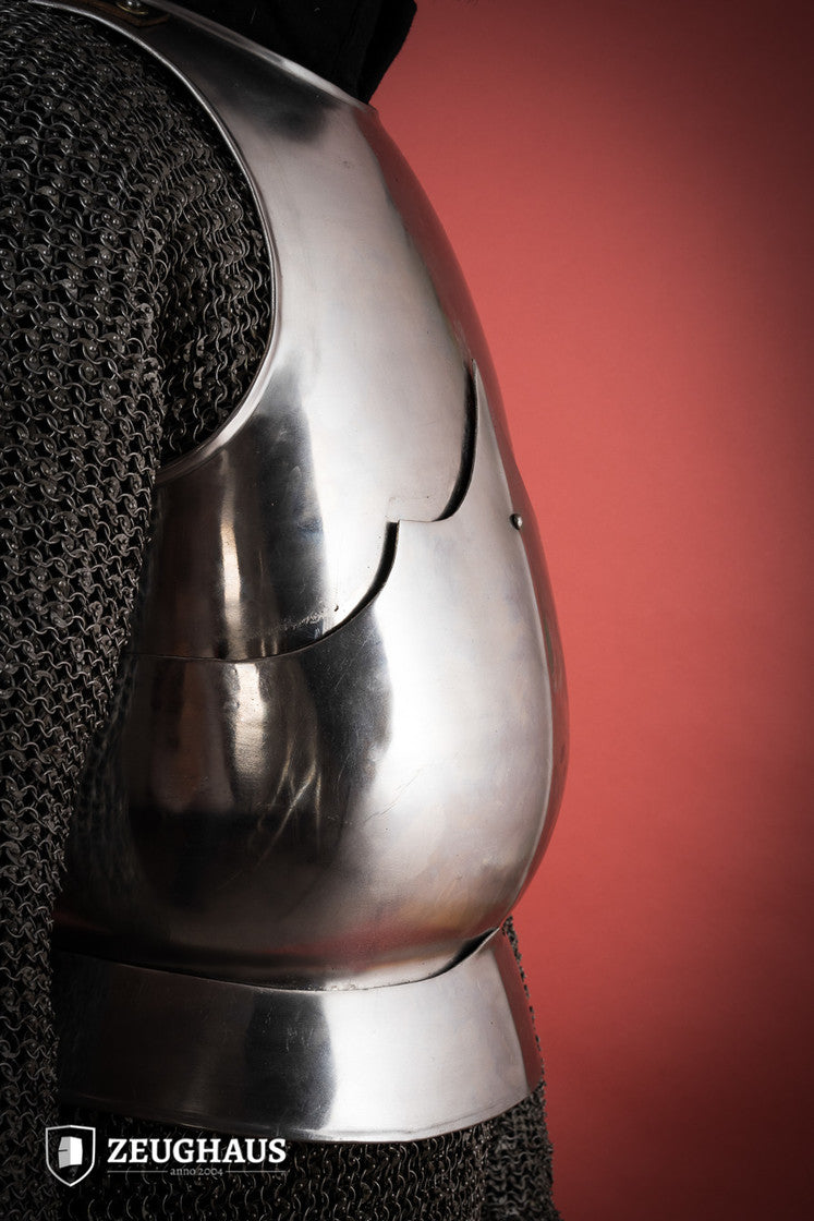 15th Century polished steel breastplate with riveted joints, showcasing historical armor design.