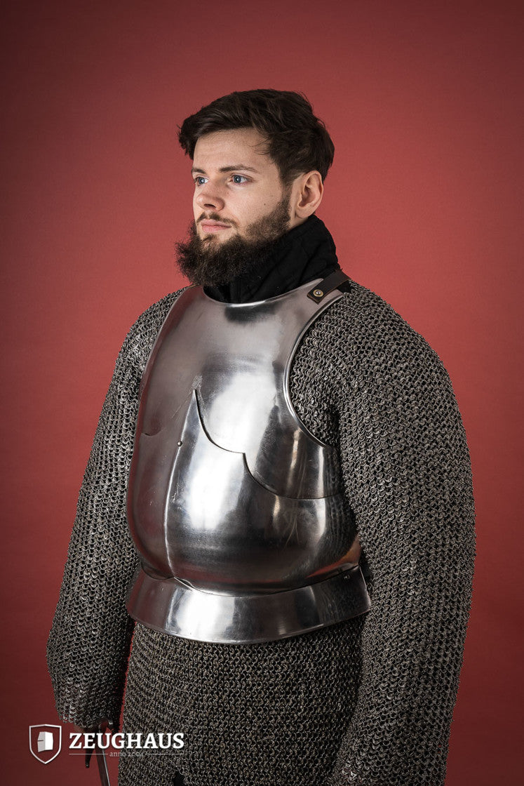 15th Century polished steel breastplate with riveted joints, showcasing historical armor design.