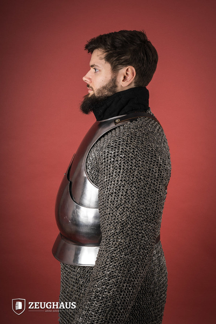 15th Century polished steel breastplate with riveted joints, showcasing historical armor design.
