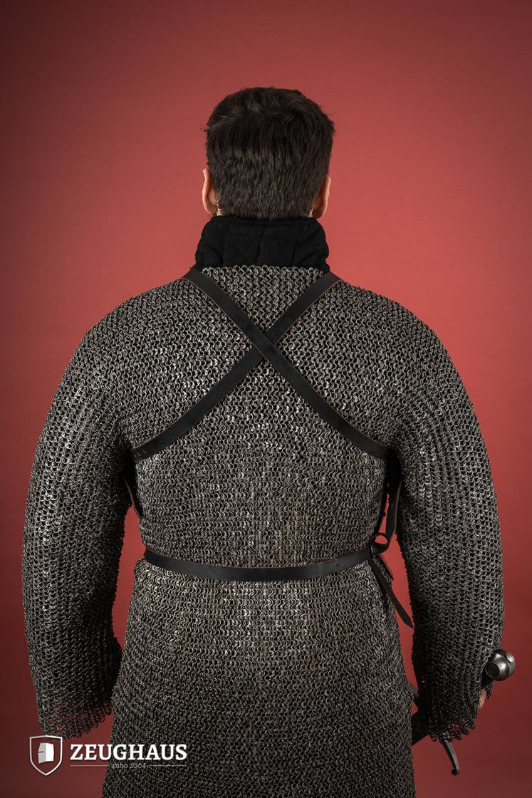 15th Century polished steel breastplate with riveted joints, showcasing historical armor design.