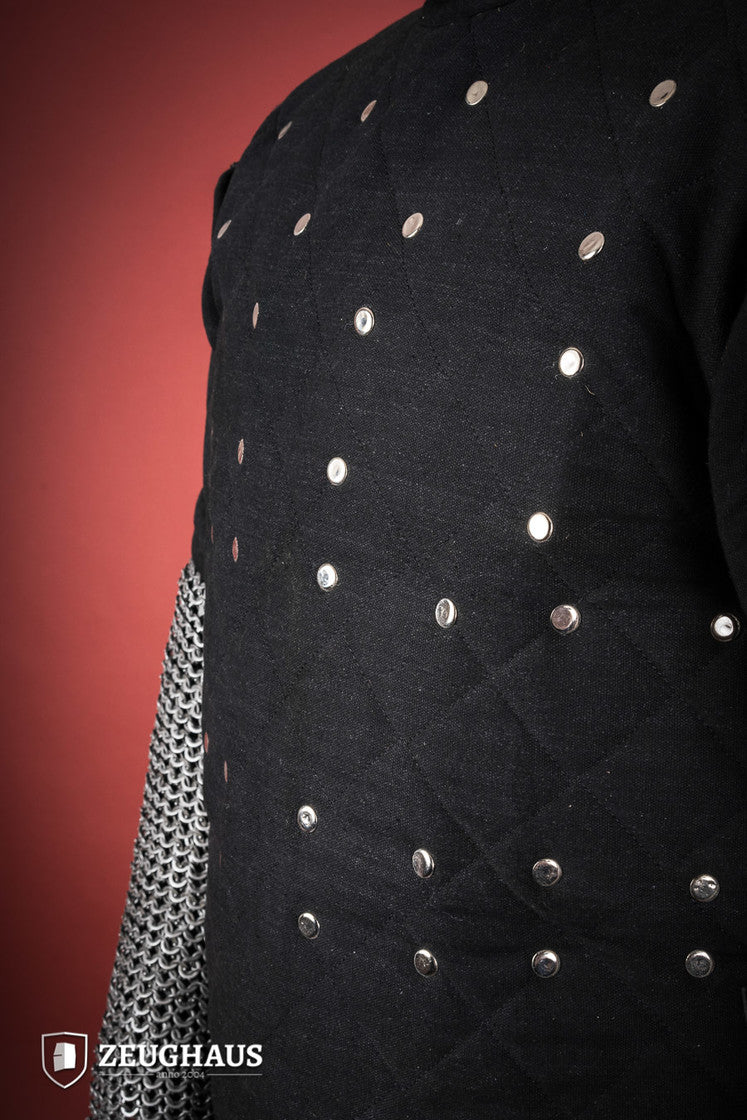 Brigantine Black body armor featuring riveted steel plates and leather straps, designed for comfort and protection in LARP and exhibition combat.