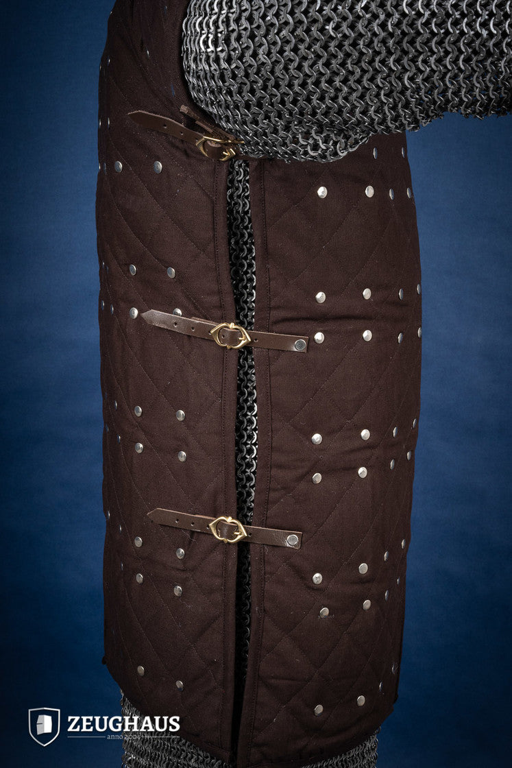 Brown Brigantine armor with studded detailing and leather straps, designed for warriors.