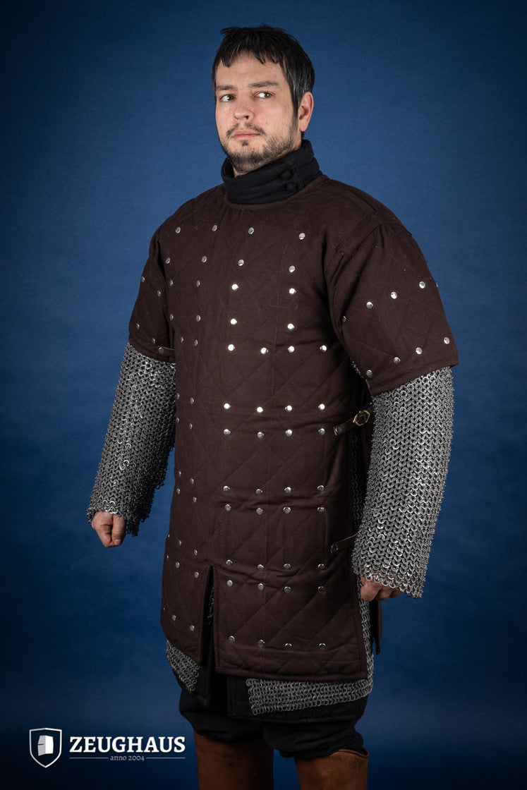 Brown Brigantine armor with studded detailing and leather straps, designed for warriors.