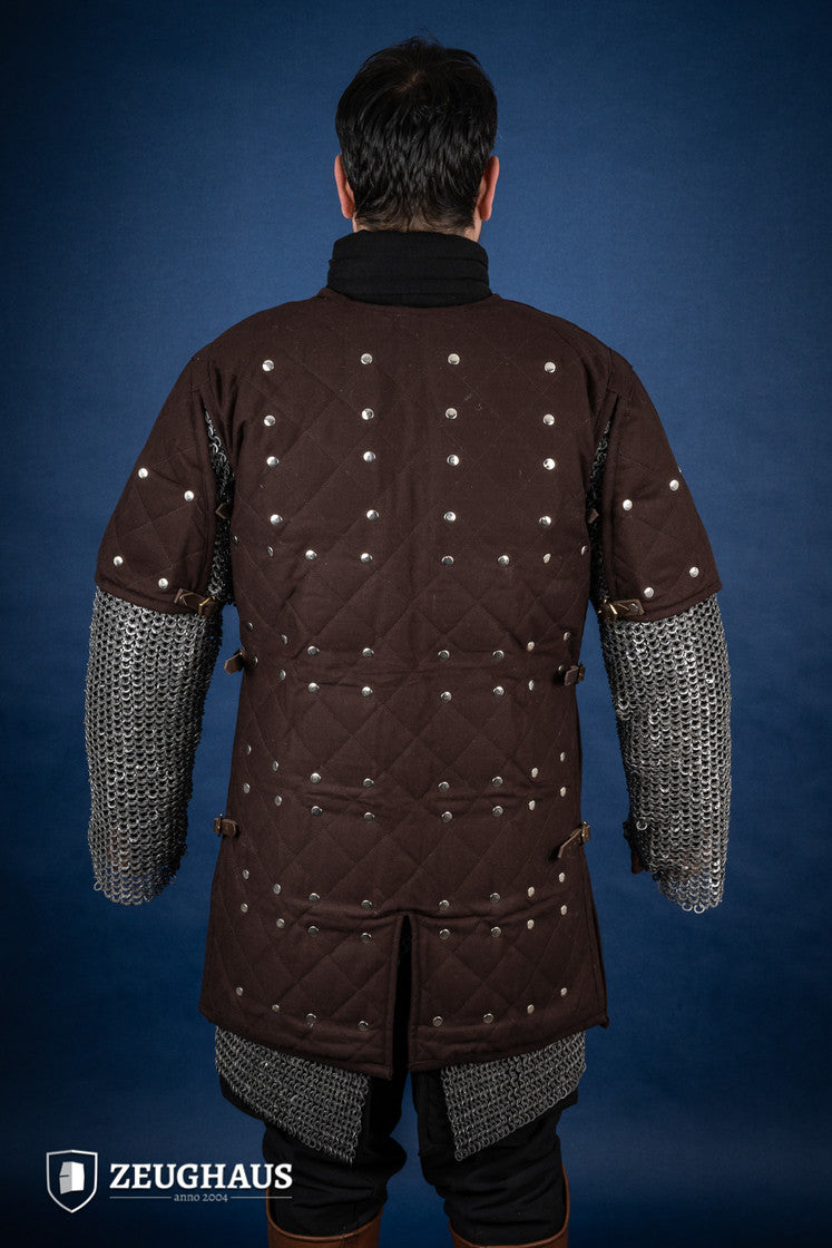 Brown Brigantine armor with studded detailing and leather straps, designed for warriors.