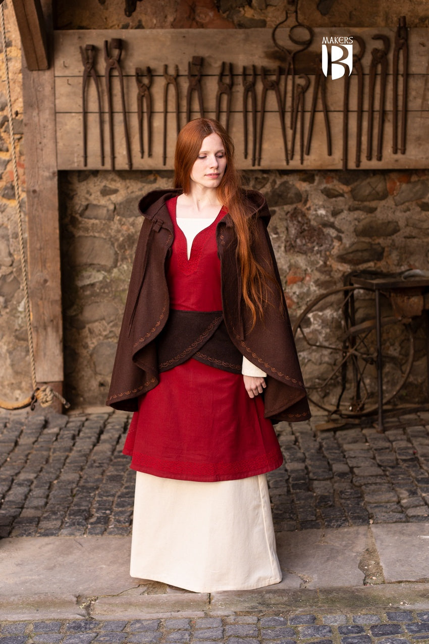 A stylish brown wool felt cape with a pointed hood and ornamental embroidery, designed for warmth and elegance.