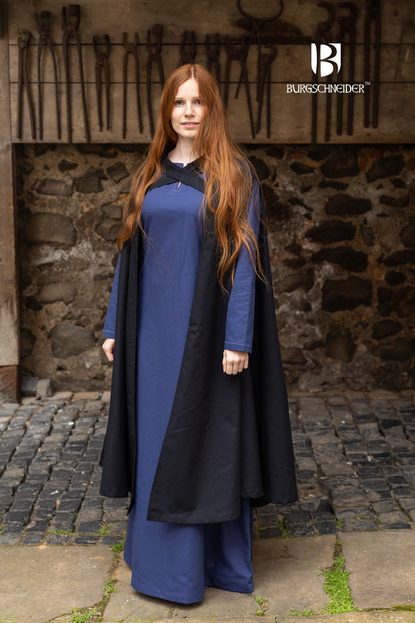 A stylish black cape made of lightweight cotton, featuring cross-over bindings that fasten below the cape, perfect for rogues and rangers.