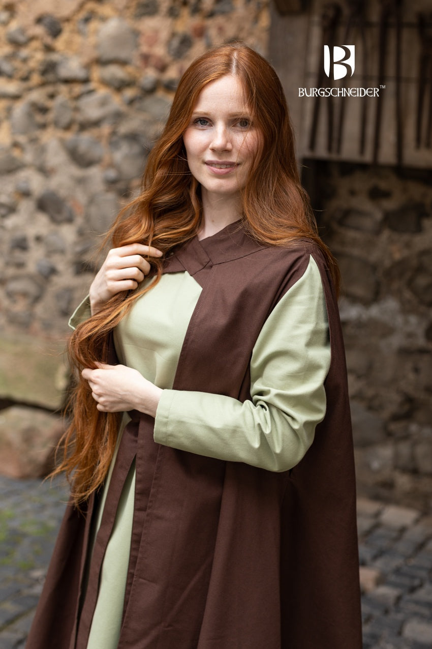 A stylish brown cape made of lightweight cotton, featuring cross-over bindings that enhance its rogue and ranger aesthetic.