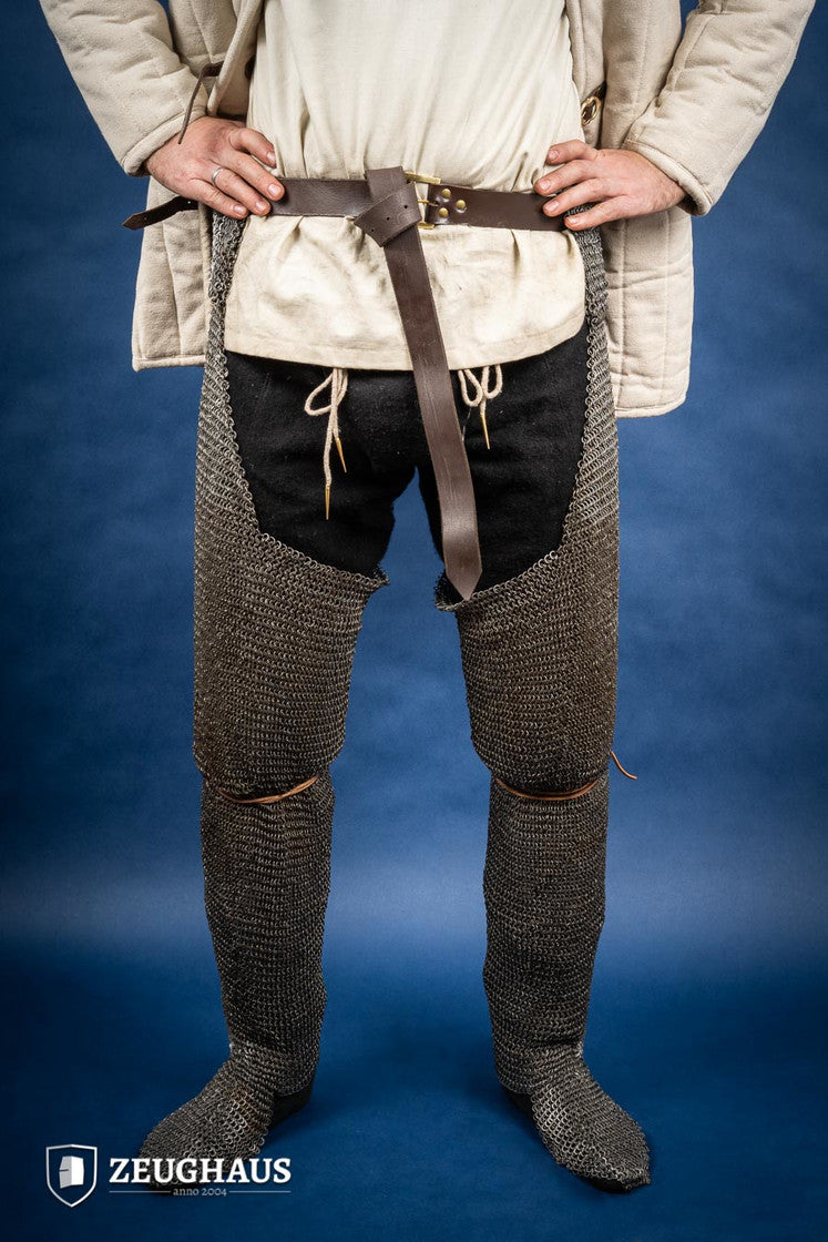 Chainmail Chausses made of 6mm oiled mild steel with flat riveted rings, showcasing intricate craftsmanship and historical design.