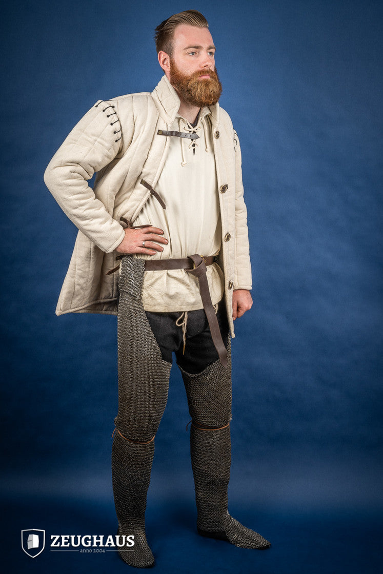 Chainmail Chausses made of 6mm oiled mild steel with flat riveted rings, showcasing intricate craftsmanship and historical design.