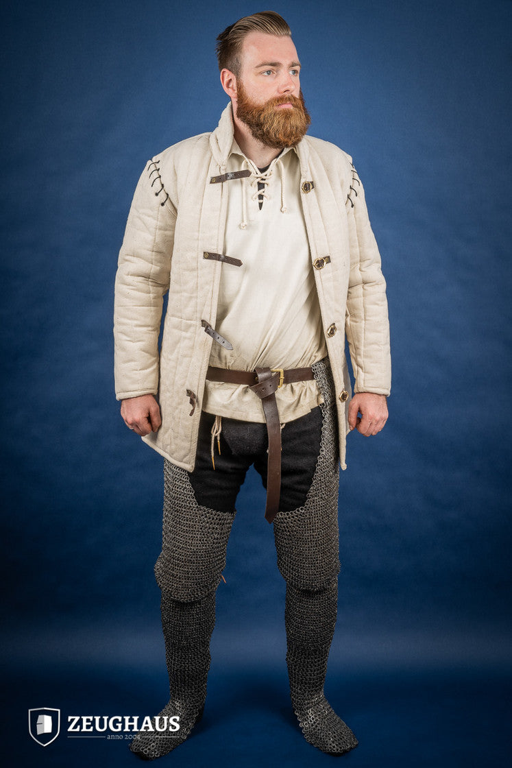 Chainmail chausses made of 9mm oiled mild steel, featuring flat rings and riveted construction, ideal for historical reenactments.