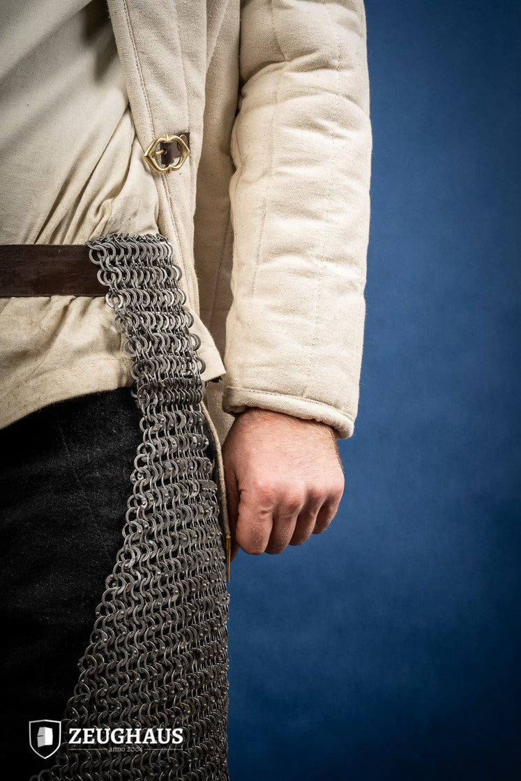 Chainmail chausses made of 9mm oiled mild steel, featuring flat rings and riveted construction, ideal for historical reenactments.