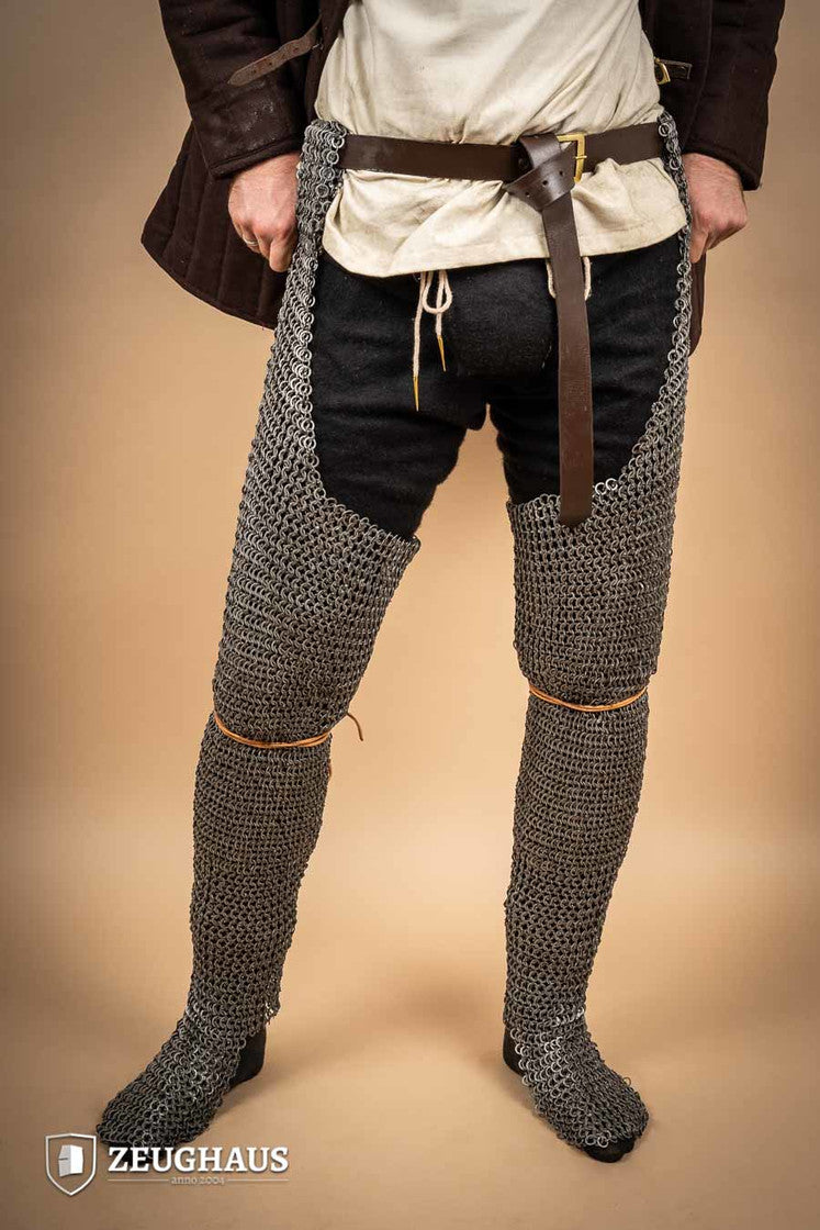 Chainmail Chausses made of oiled mild steel with flat rings, showcasing riveted construction and European 4-in-1 braid type.