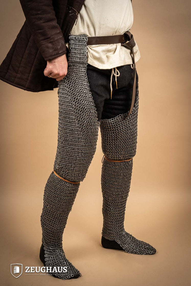 Chainmail Chausses made of oiled mild steel with flat rings, showcasing riveted construction and European 4-in-1 braid type.