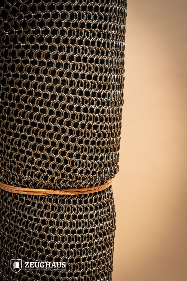 Chainmail chausses made of oiled mild steel with 9mm round rings, showcasing European 4-in-1 braid design.