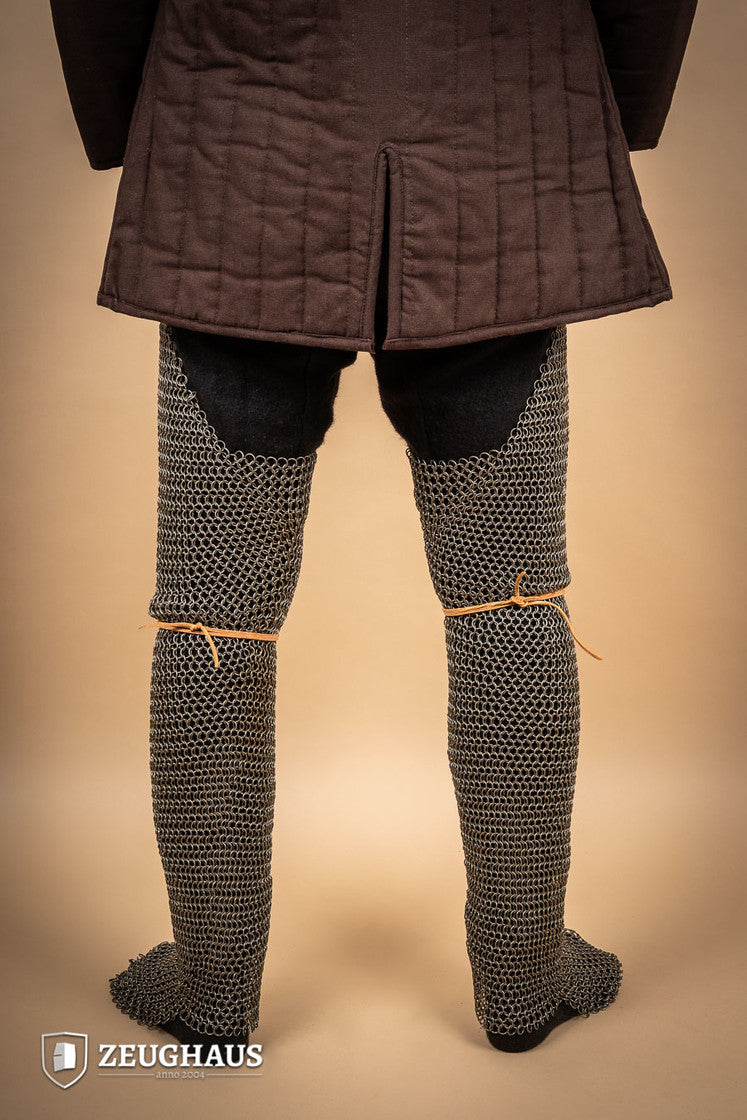 Chainmail chausses made of oiled mild steel with 9mm round rings, showcasing European 4-in-1 braid design.