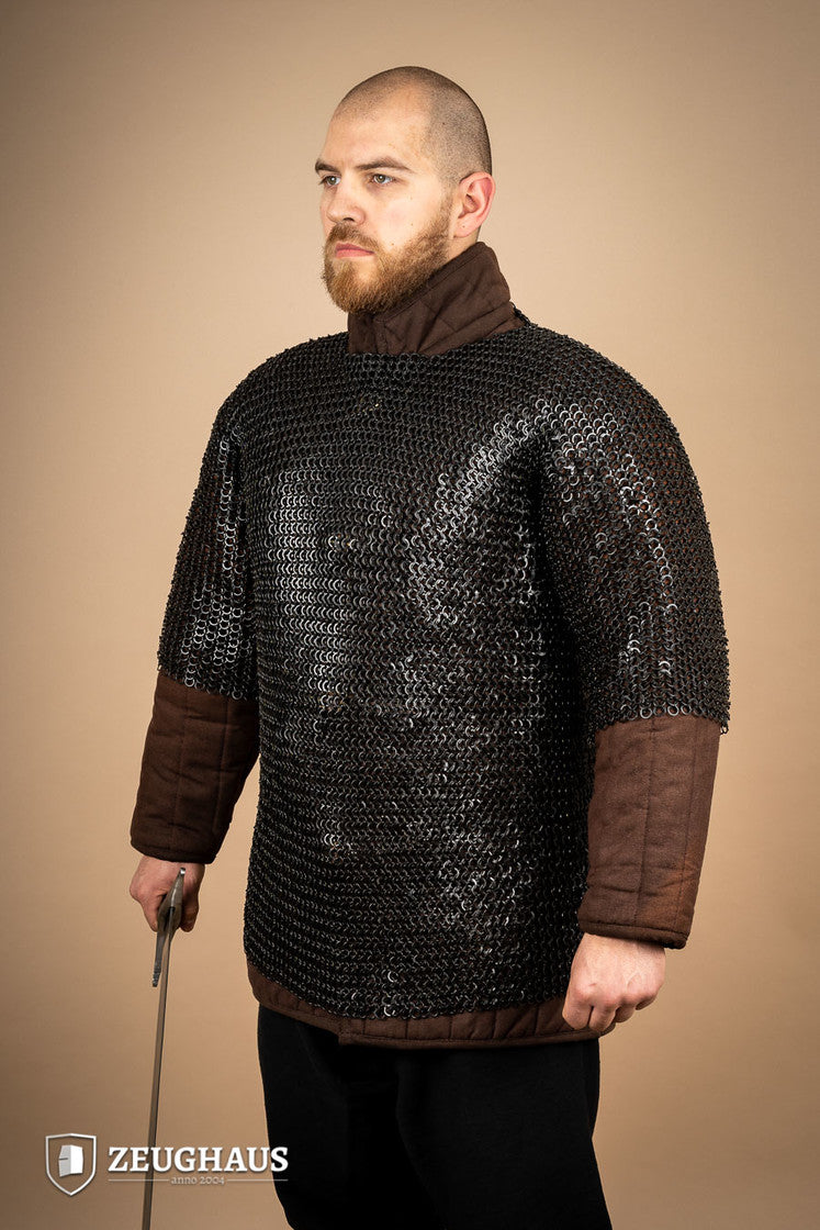 Chainmail Haubergeon made of mild steel with burnished finish, featuring flat rings and riveted design, suitable for reenactments and cosplay.