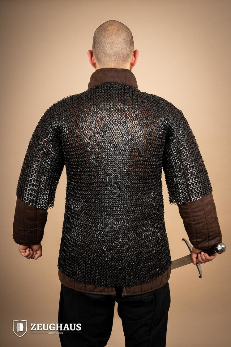 Chainmail Haubergeon made of mild steel with burnished finish, featuring flat rings and riveted design, suitable for reenactments and cosplay.