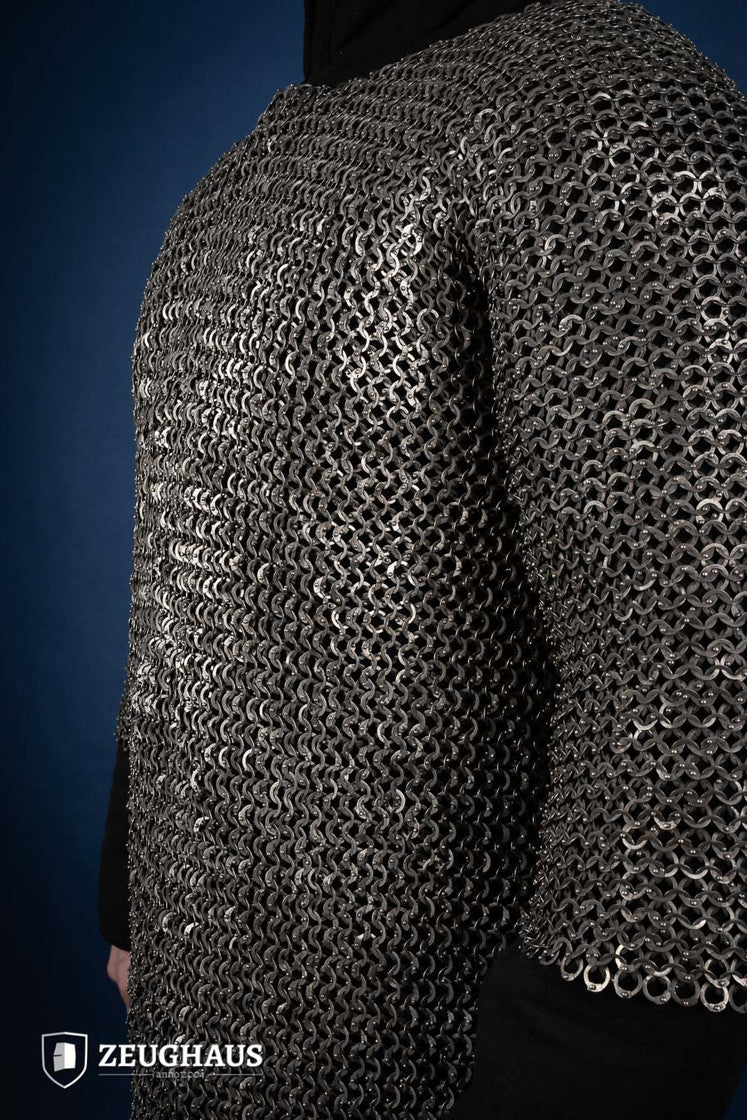 Chainmail Haubergeon made of 9mm stainless steel with flat rings, riveted construction, showcasing its natural oiled finish and European 4-in-1 braid type.