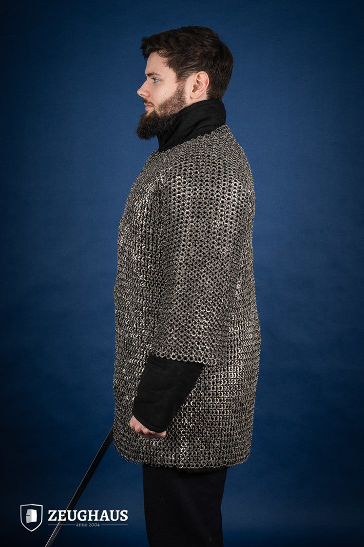 Chainmail Haubergeon made of 9mm stainless steel with flat rings, riveted construction, showcasing its natural oiled finish and European 4-in-1 braid type.