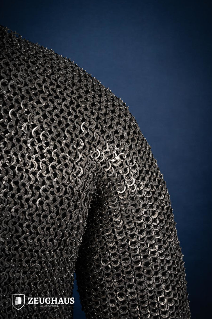 Chainmail Haubergeon made of 9mm stainless steel with flat rings, riveted construction, showcasing its natural oiled finish and European 4-in-1 braid type.