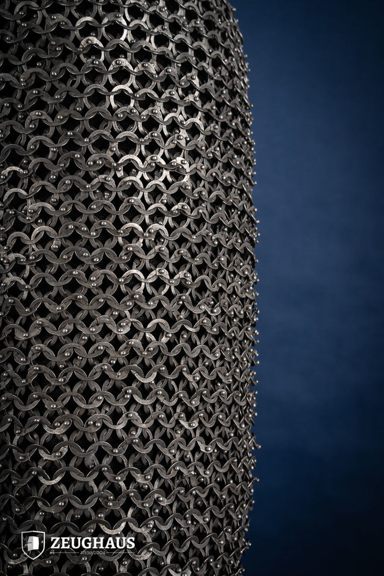 Chainmail Haubergeon made of 9mm stainless steel with flat rings, riveted construction, showcasing its natural oiled finish and European 4-in-1 braid type.