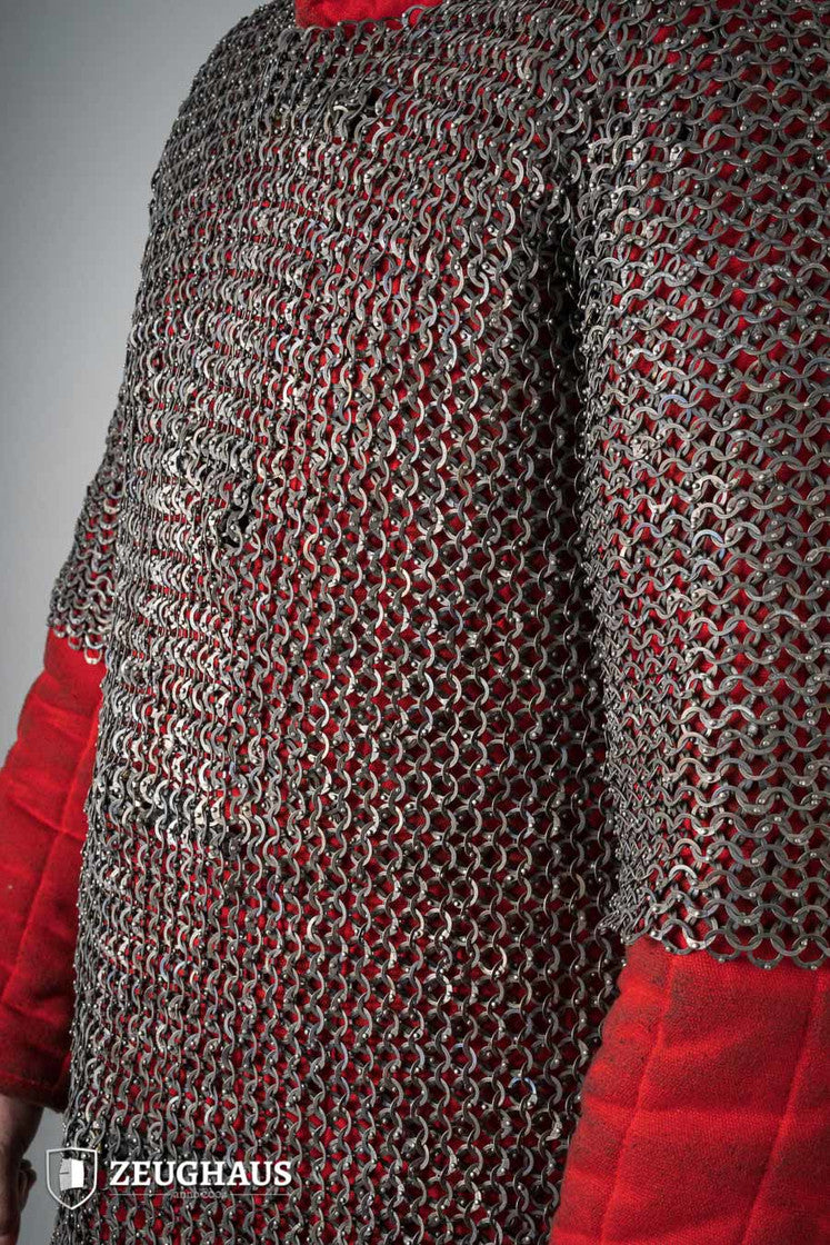 Chainmail Haubergeon made of titanium with 9mm flat rings, showcasing riveted construction and European 4-in-1 braid type.