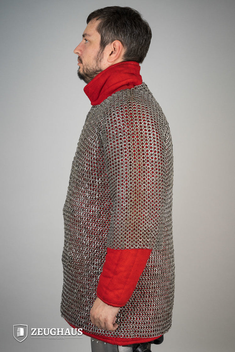 Chainmail Haubergeon made of oiled mild steel with 9mm flat rings, showcasing its intricate wedge riveting and European 4-in-1 braid design.