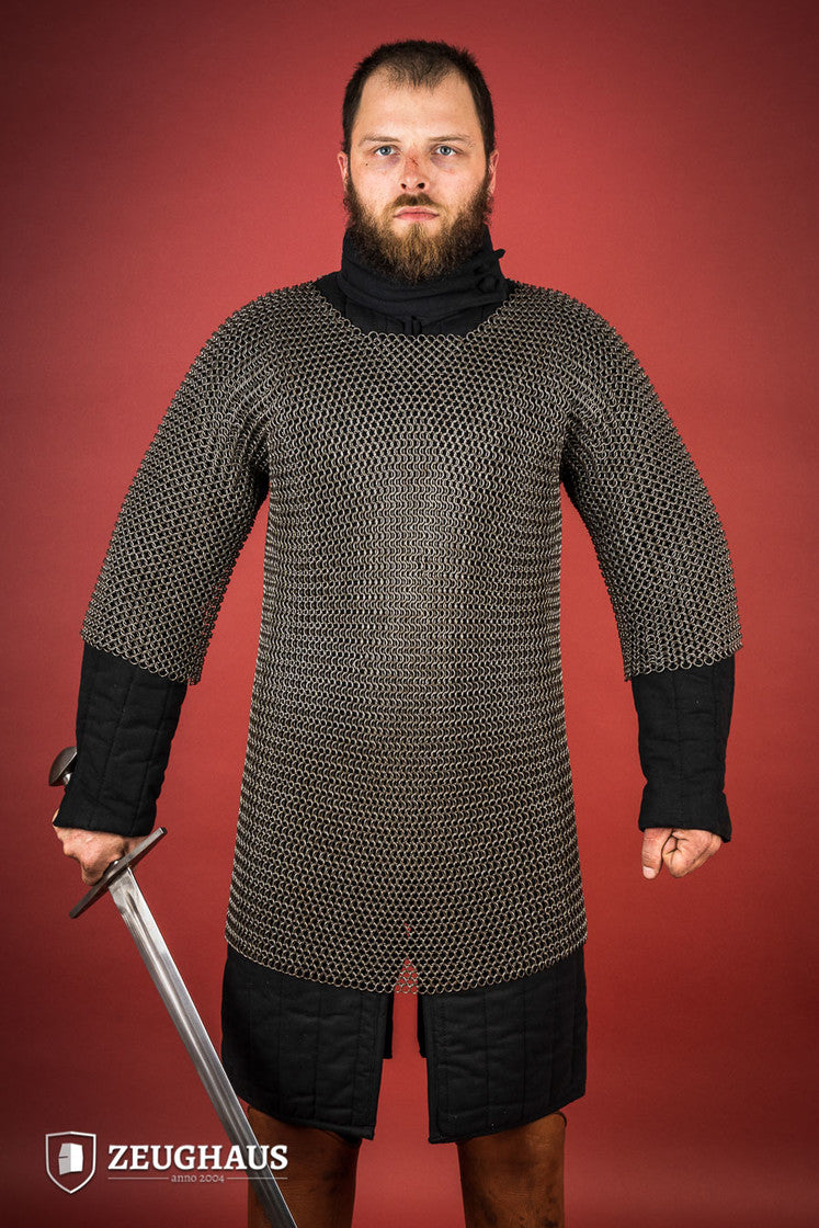 Chainmail Haubergeon made of 9mm steel with an oiled finish, featuring round rings and European 4-in-1 braid type, displayed on a mannequin.