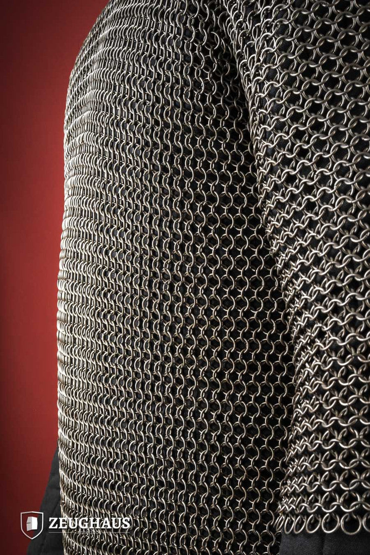 Chainmail Haubergeon made of 9mm steel with an oiled finish, featuring round rings and European 4-in-1 braid type, displayed on a mannequin.