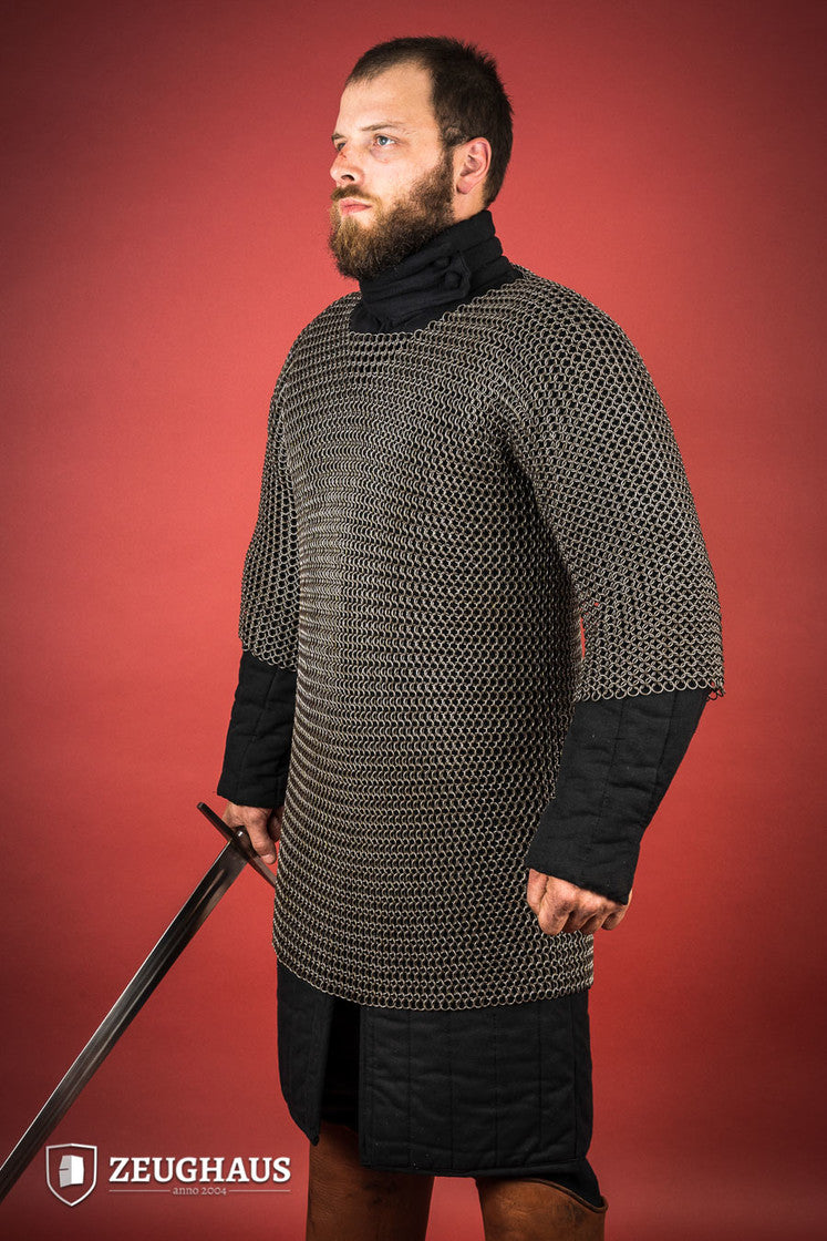 Chainmail Haubergeon made of 9mm steel with an oiled finish, featuring round rings and European 4-in-1 braid type, displayed on a mannequin.