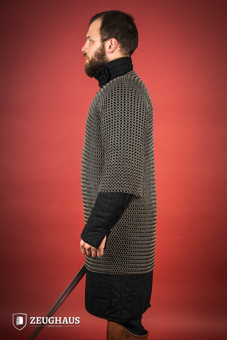 Chainmail Haubergeon made of 9mm steel with an oiled finish, featuring round rings and European 4-in-1 braid type, displayed on a mannequin.