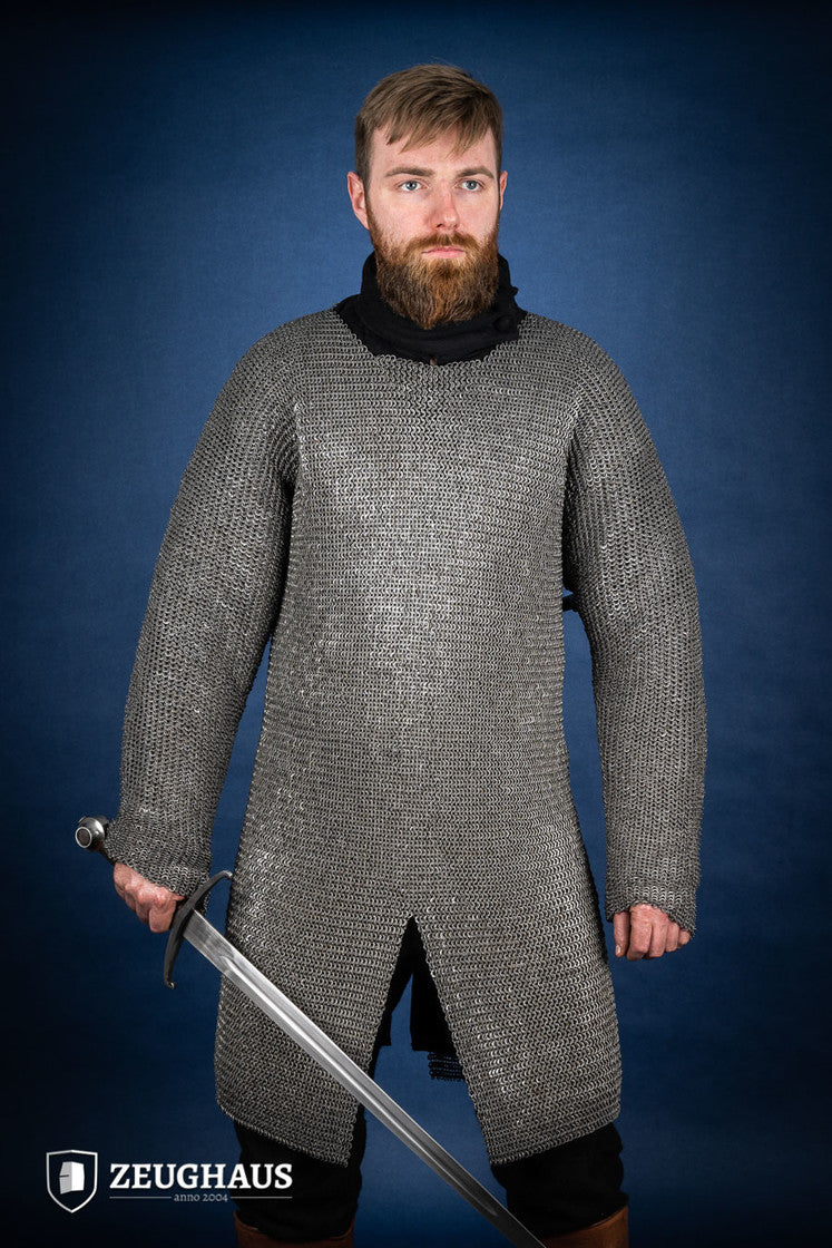 Chainmail Hauberk made of 6mm oiled mild steel with flat rings, showcasing its intricate riveted design and European 4-in-1 braid style.