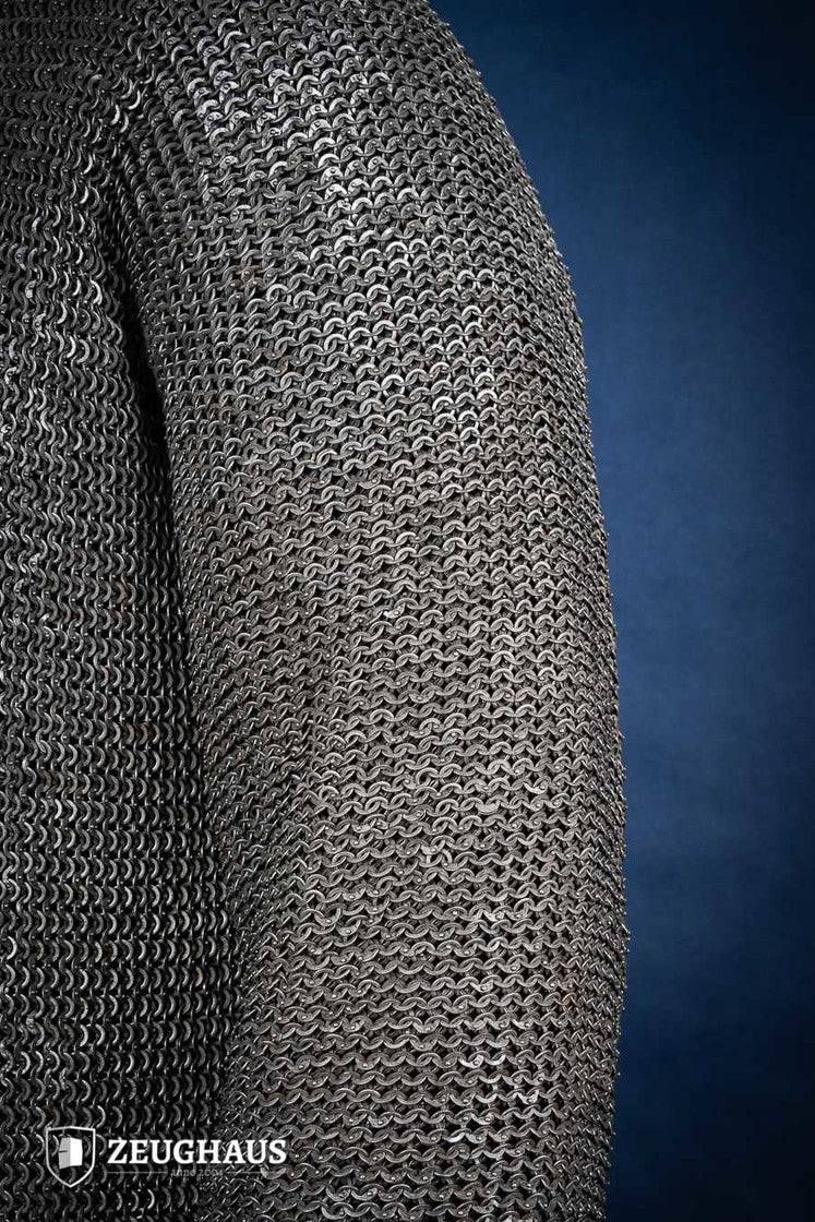Chainmail Hauberk made of 6mm oiled mild steel with flat rings, showcasing its intricate riveted design and European 4-in-1 braid style.
