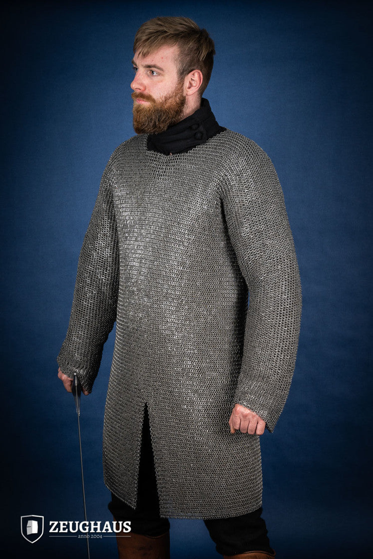 Chainmail Hauberk made of 6mm oiled mild steel with flat rings, showcasing its intricate riveted design and European 4-in-1 braid style.