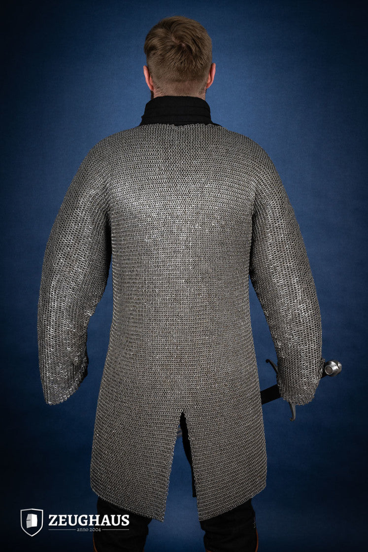 Chainmail Hauberk made of 6mm oiled mild steel with flat rings, showcasing its intricate riveted design and European 4-in-1 braid style.