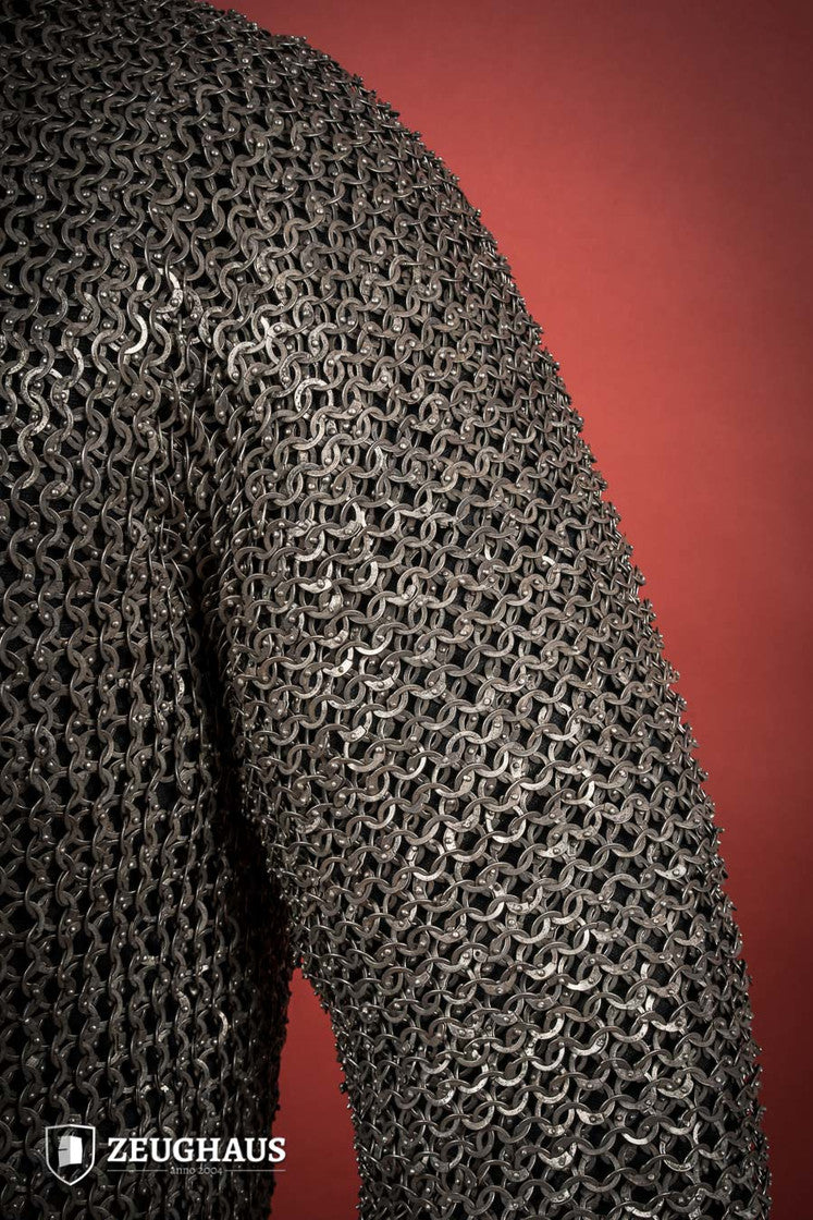 Chainmail Hauberk made of riveted 9mm stainless steel with flat rings, showcasing its natural oiled finish and European 4-in-1 braid type.