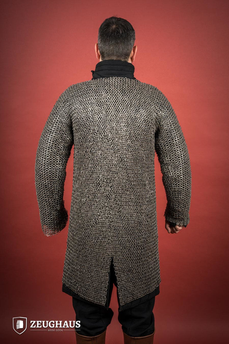 Chainmail Hauberk made of riveted 9mm stainless steel with flat rings, showcasing its natural oiled finish and European 4-in-1 braid type.