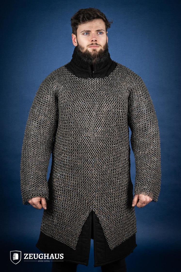 A detailed view of the Chainmail Hauberk Flatring Riveted 9mm Titanium, showcasing its long sleeves, split design, and riveted flat rings for enhanced protection.