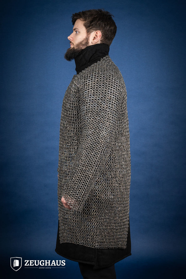 A detailed view of the Chainmail Hauberk Flatring Riveted 9mm Titanium, showcasing its long sleeves, split design, and riveted flat rings for enhanced protection.