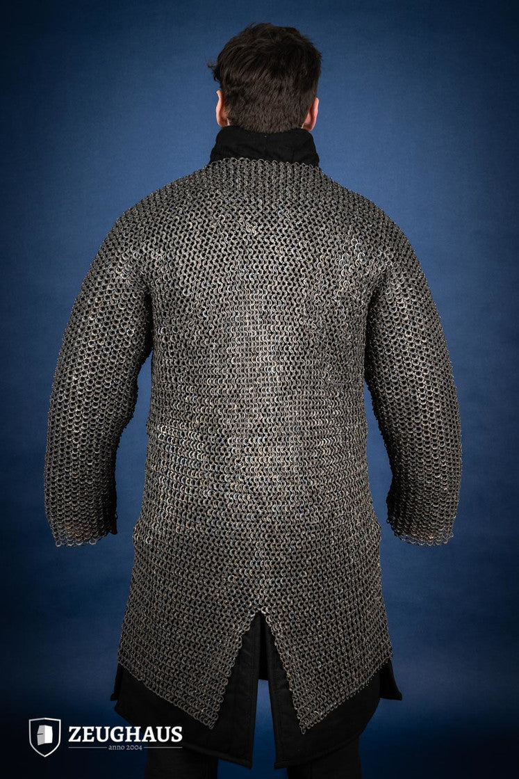 A detailed view of the Chainmail Hauberk Flatring Riveted 9mm Titanium, showcasing its long sleeves, split design, and riveted flat rings for enhanced protection.